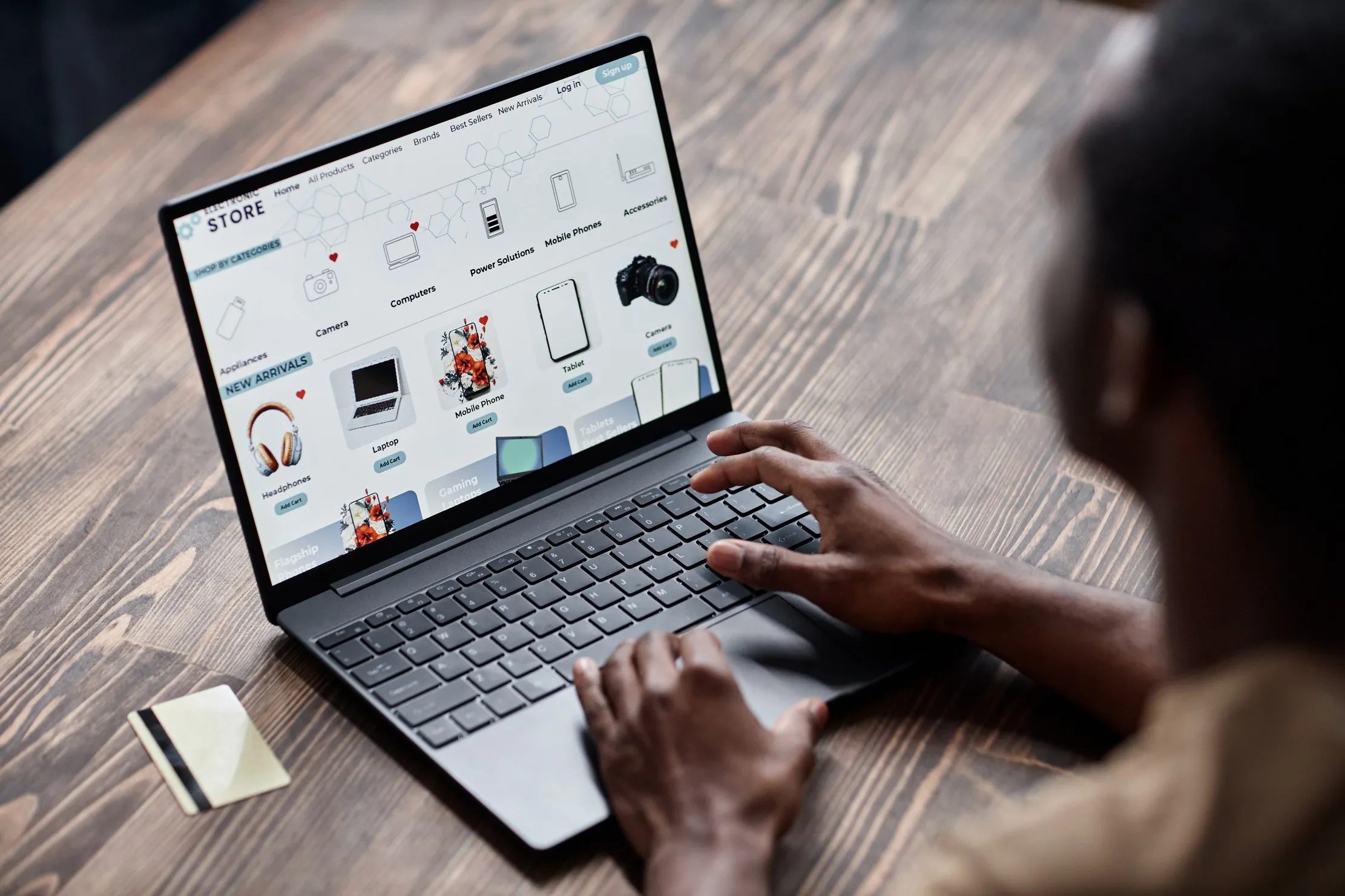 A person using a laptop to browse an online store, representing a bilingual website after launch