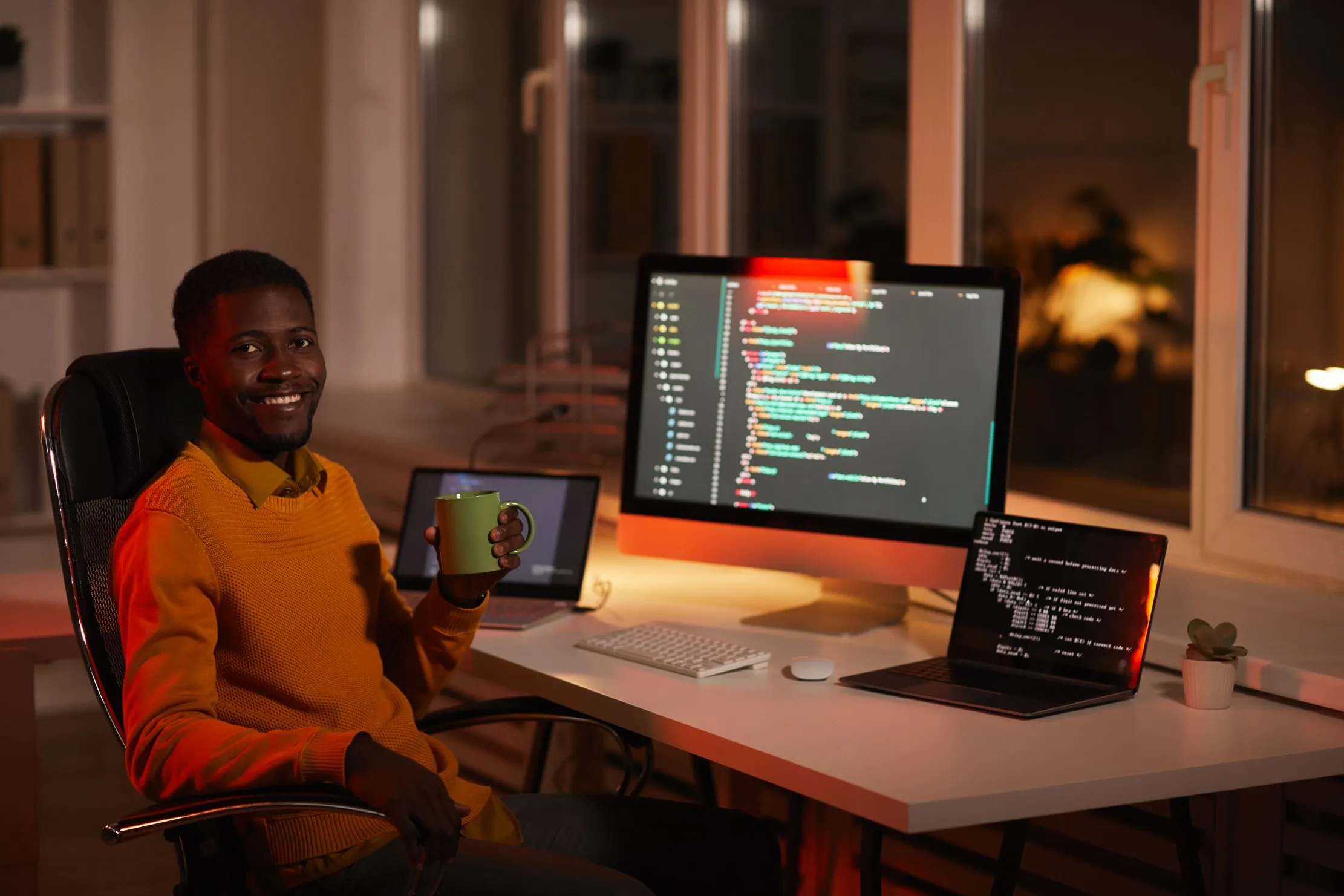 IT professional at his workstation, representing staff availability and technical readiness ahead of an ERP rollout