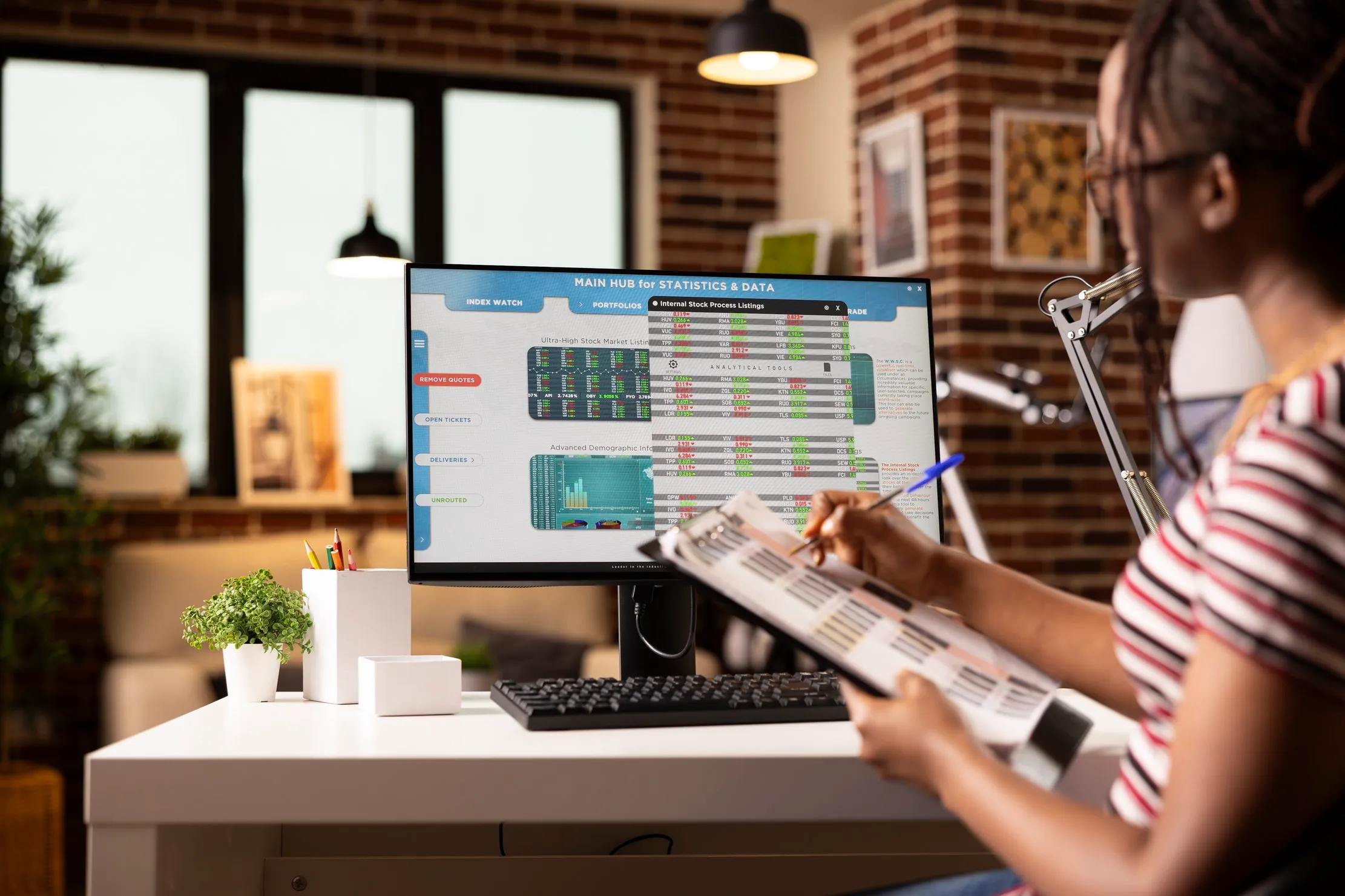 Property manager reviewing printed records against data on a monitor, representing checking a recorded lease date against the executed document